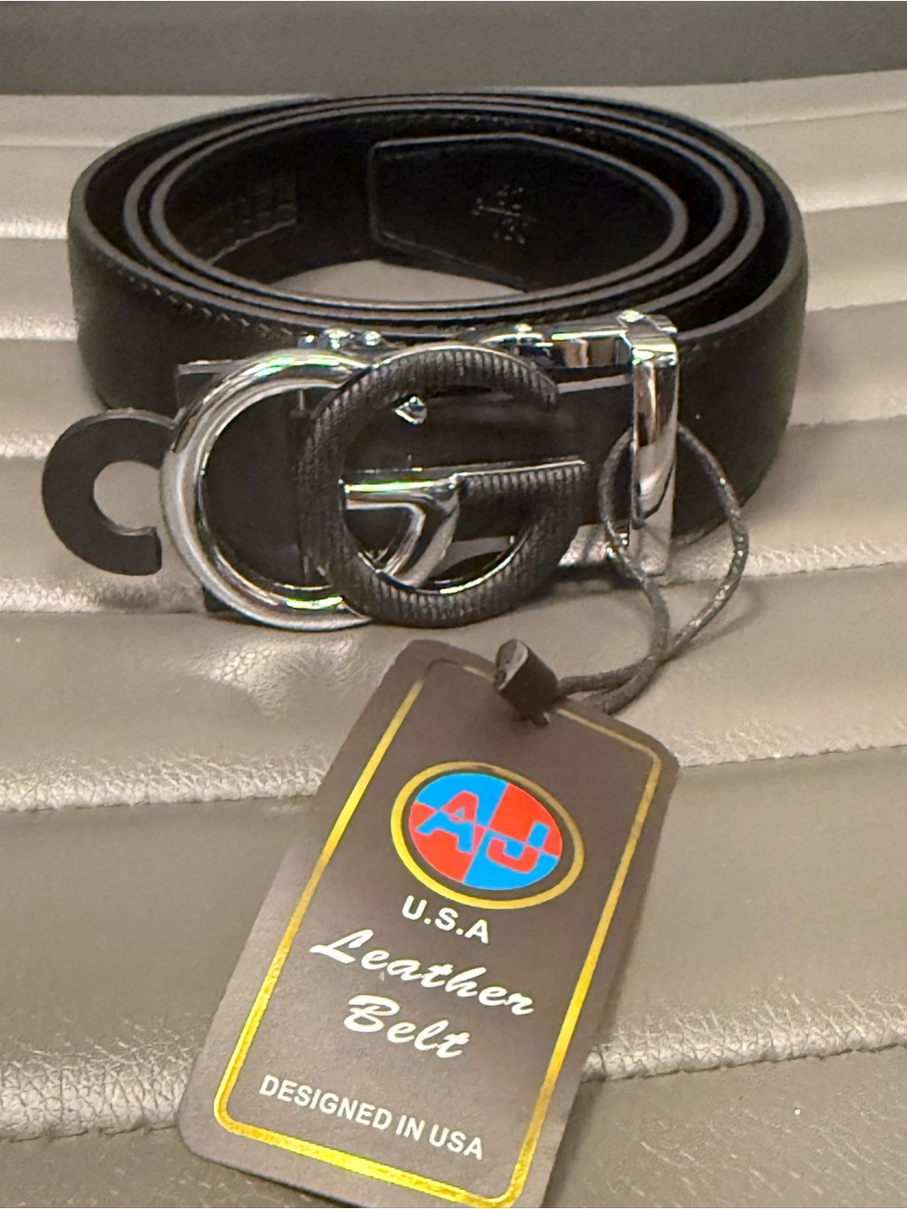 Black Leather Belt with Silver DoubleG Buckle
Size 42-44easy to cut smaller size
